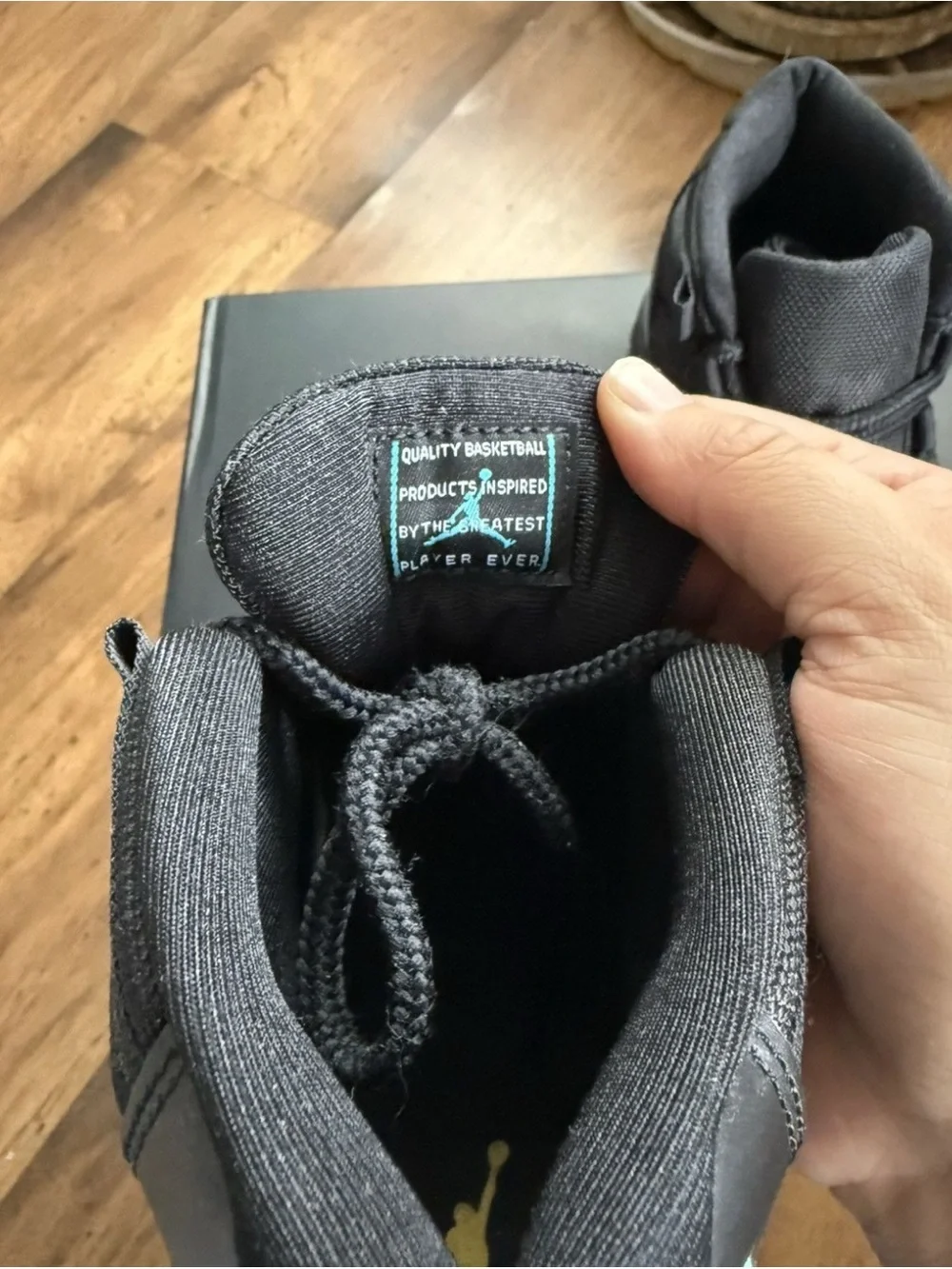 Jordan 11 Retro Black with Teal Accents
